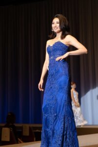 A candidate of Mrs. Earth Japan 2021 wearing blue gown