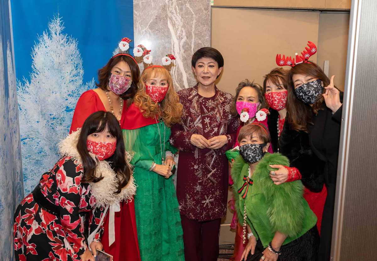 Group of women wearing the mask posing for the picture.