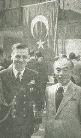 Captain Cemal Uren, Turkish military attache, pauses with Shigeru Ymamamoto.