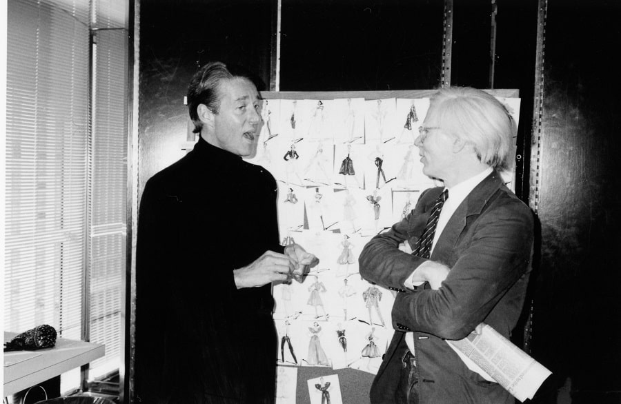 Halston having a chat with his friend Andy Warhol.