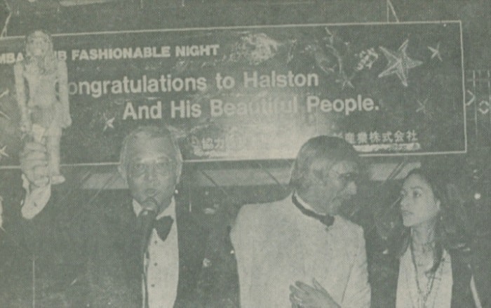 Entertainer Jerry Ito helps Bill Hersey and Olivia Hussey auction off some Egyptian art work she donated to the Red Cross auction.