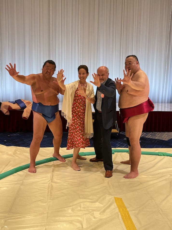 Ambassador of Greece to Japan H.E. Dimitris Caramitsos-Tziras taking picture with SUMO wrestlers.