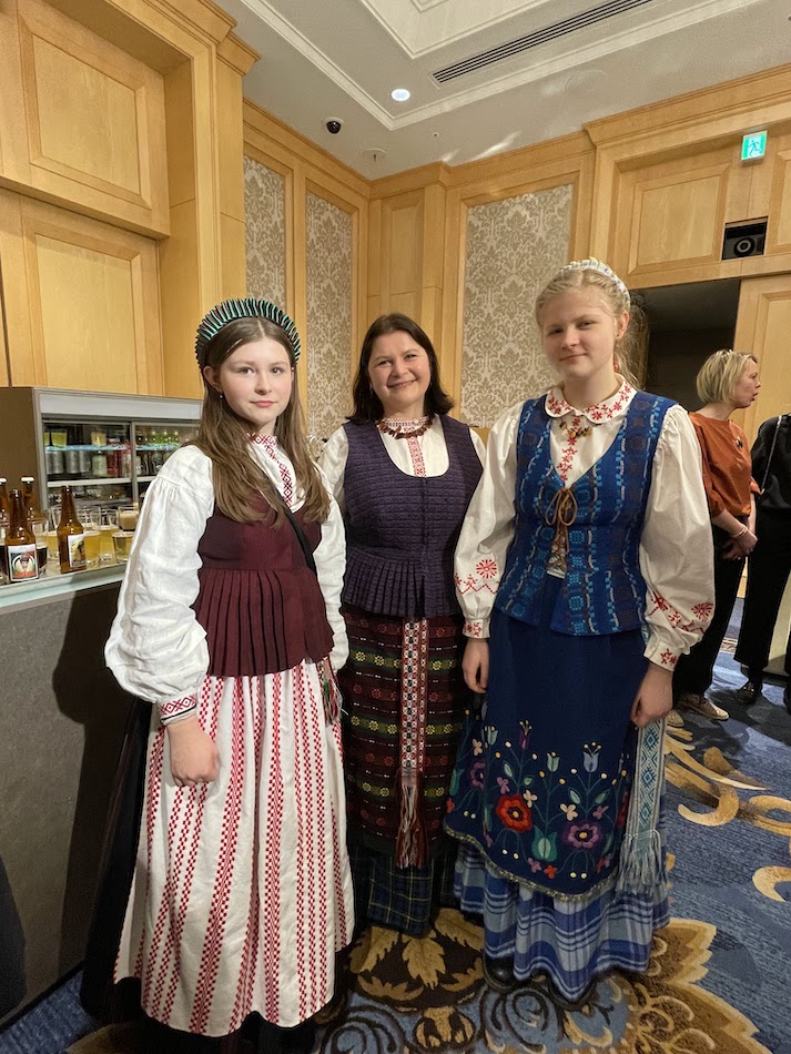 Staffs  wearing beautiful Lithuanian traditional costumes.
