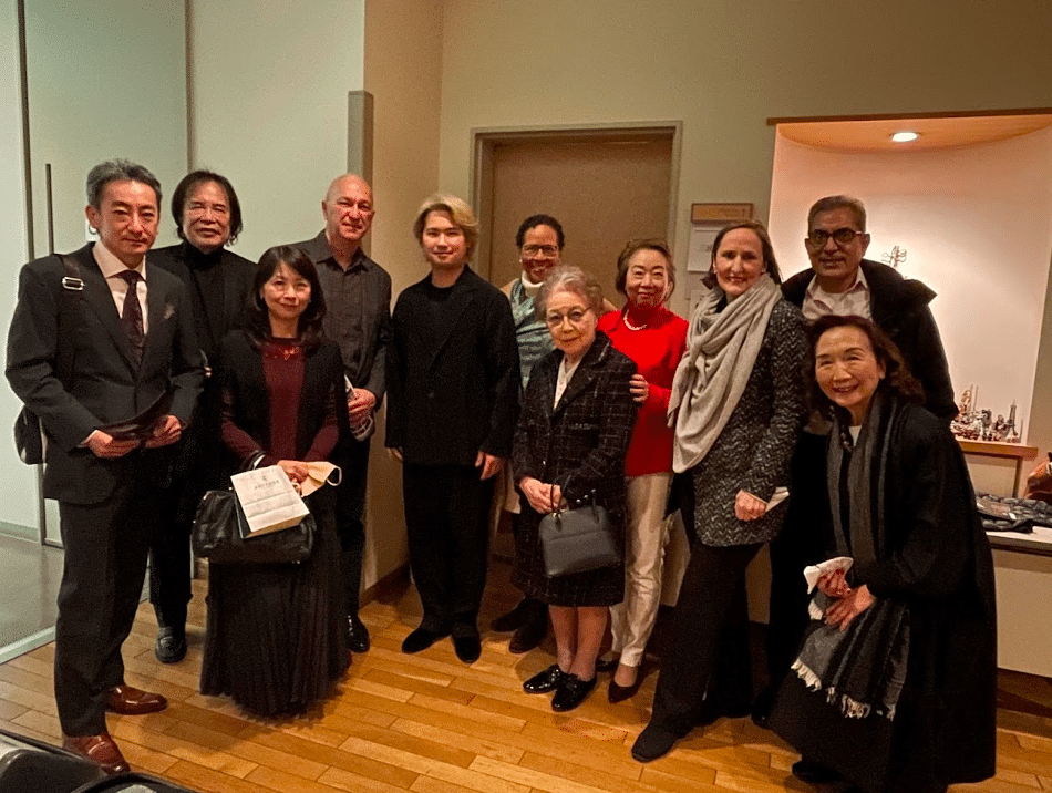 Fumiaki Miura surrounded by Professor Tsugio Tokunaga and the diplomatic corps after the concert