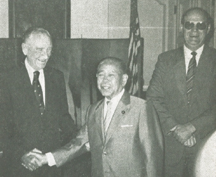 : Ambassador Mansfield receives congratulation from Japan's Minister of Agriculture Iwazo Kaneko, as U.S. Embassy Counsellor for Agriculture William L. Davis Jr. shares the chuckle
