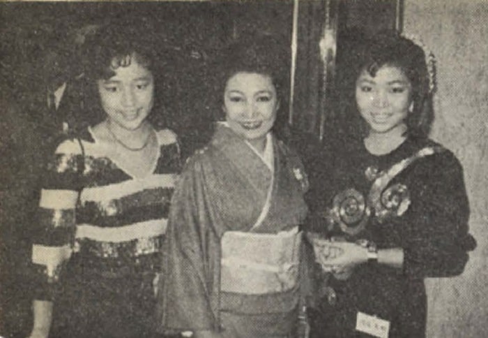 Misa Watanabe, wife of the honoree, flanked by their two daughters Mayumi and Miki
