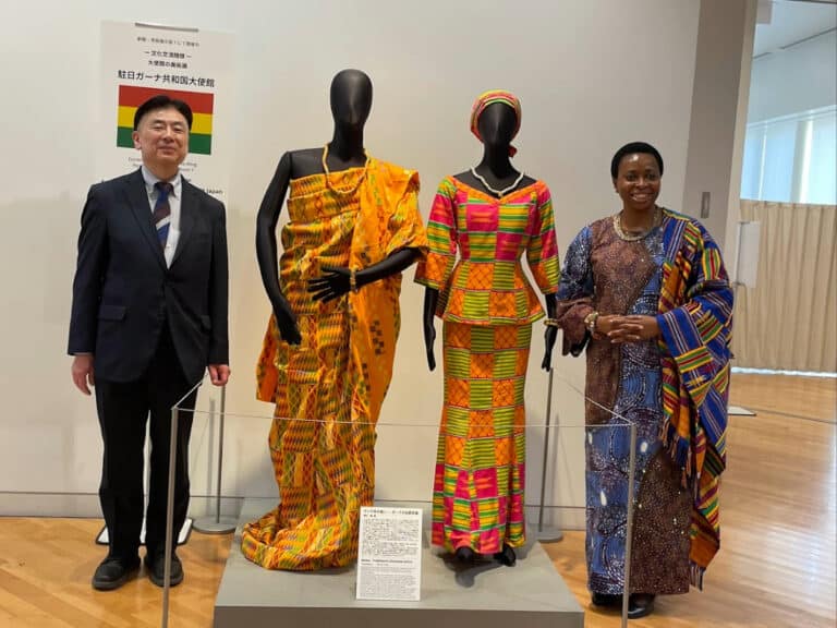 Ambassador Genevieve Edna Apaloo and Professor Yoshiro Shimizu standing with traditional Ghanaian attire at Tokyo Fuji Art Museum.
