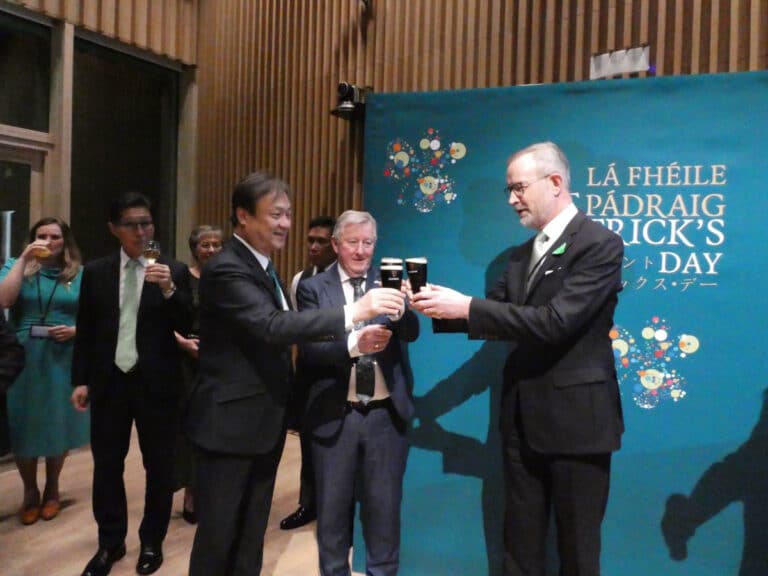 Ambassador Damien Cole and Minister Sean Canney celebrating St. Patrick's Day with a Guinness toast at the new Irish Embassy in Tokyo.
