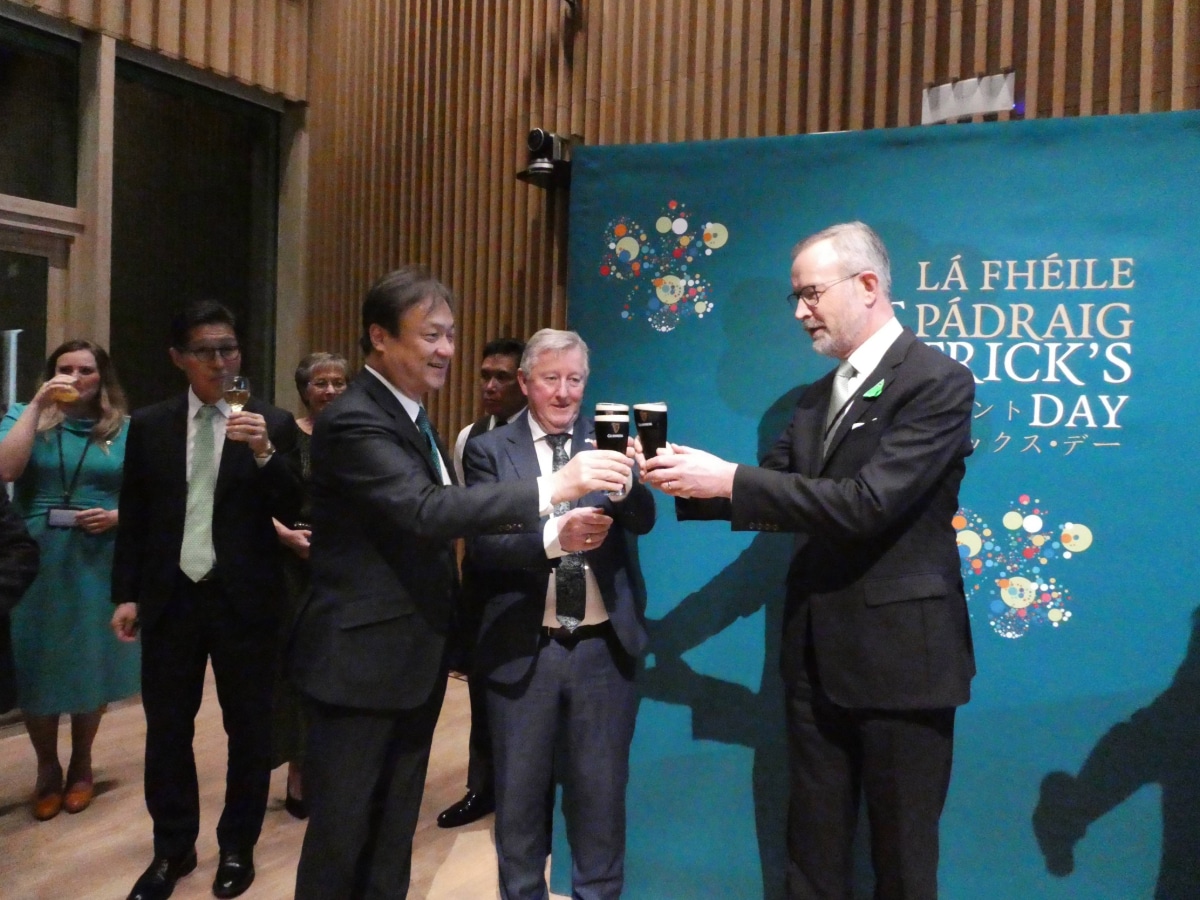 Ambassador Damien Cole and Minister Sean Canney celebrating St. Patrick's Day with a Guinness toast at the new Irish Embassy in Tokyo.
