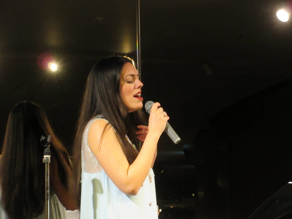 Close-up of Greek singer Ada Athanasopoulou performing Greek masterpieces.