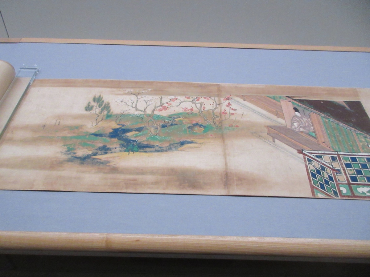 A section of the Egara Tenjin Emaki picture scroll showing plum blossoms and traditional Japanese architecture.