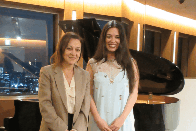Greek Ambassador Olga Kliamaki and Greek diva Ada Athanasopoulou standing together in Tokyo.