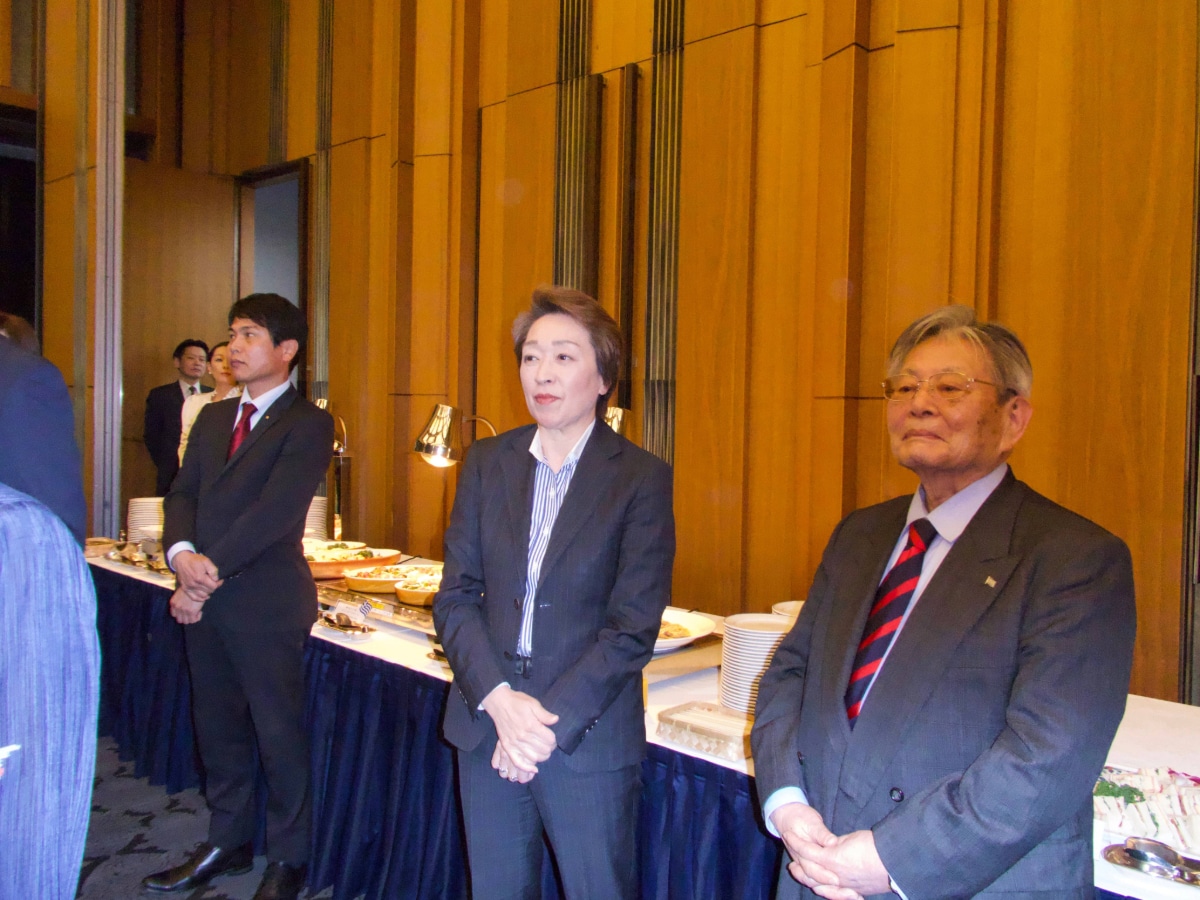 Japanese government officials and guests observing the commemorative speeches.