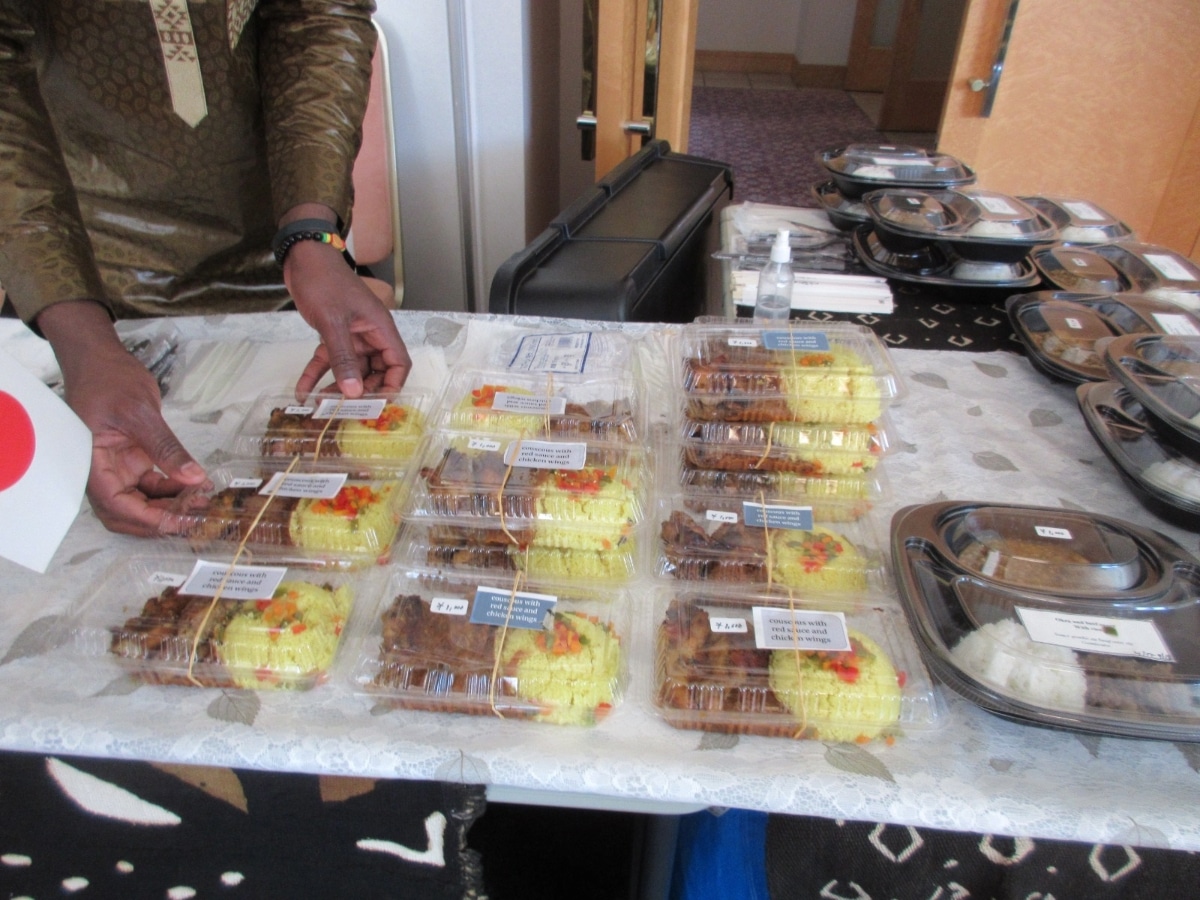Packaged African couscous with red sauce and chicken wings for sale at the Africa Up Close Bazaar in Tokyo