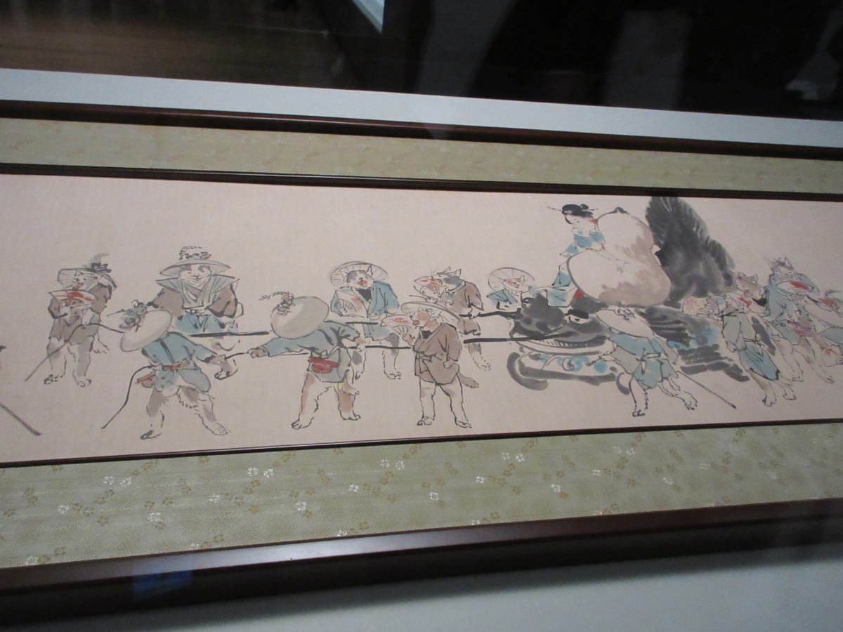 Kawanabe Kyōsai scroll depicting a procession of anthropomorphic cats in period costume, reflecting his satirical portrayal of people and society