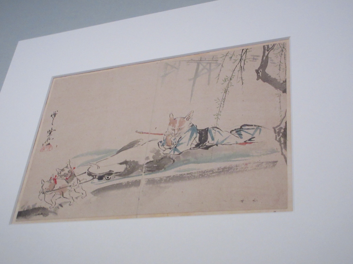 Kawanabe Kyōsai playful ink painting of a cat in samurai robes with kittens, reflecting the artist's gentle and humorous family-oriented nature