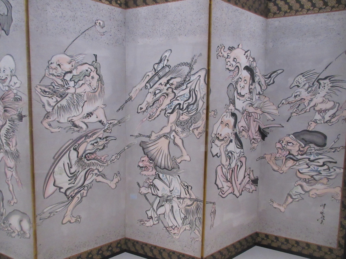 Kawanabe Kyōsai folding screen depicting a dynamic parade of oni and supernatural creatures, from the Demon chapter of the Israel Goldman Collection exhibition