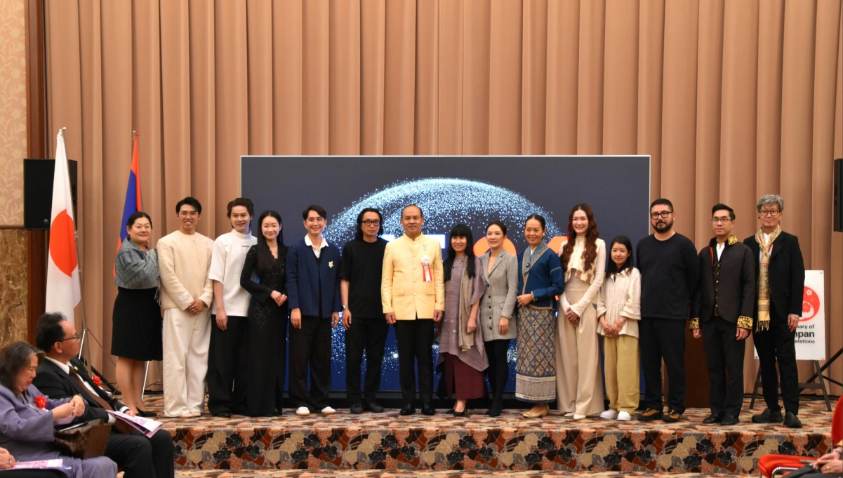 Young Laotian designers and organizers pose on stage at the Lao Fashion and Culture Festival in Japan for the 70th anniversary of Japan-Laos diplomatic relations