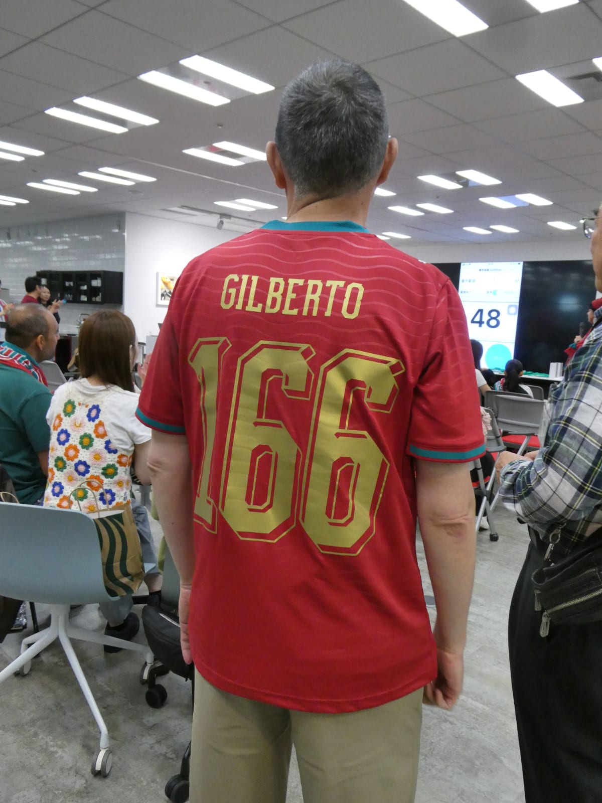 Close-up of Portugal national team PUMA jersey worn by attendee at live viewing event