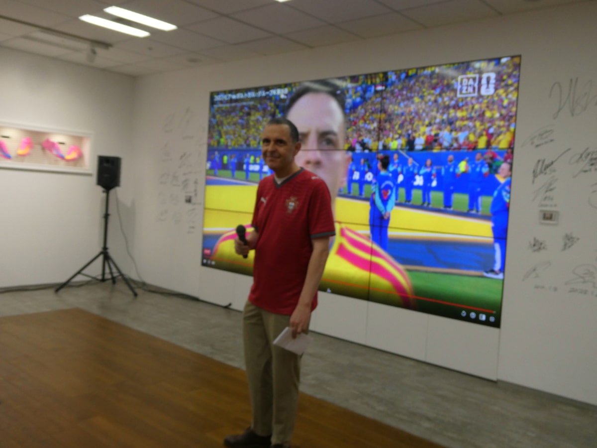 PUMA Japan event host in front of live Portugal vs Colombia World Cup match broadcast