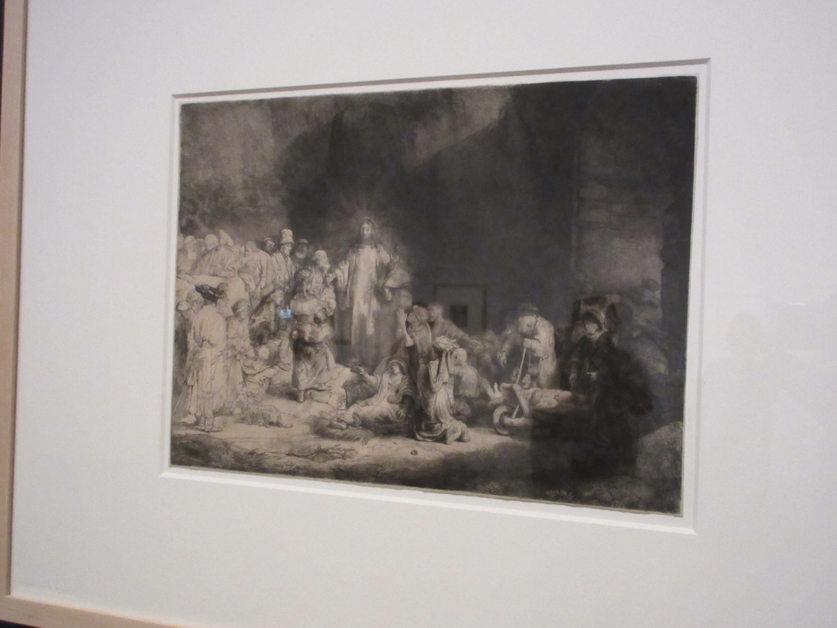 Rembrandt etching depicting a religious scene with Christ among a crowd