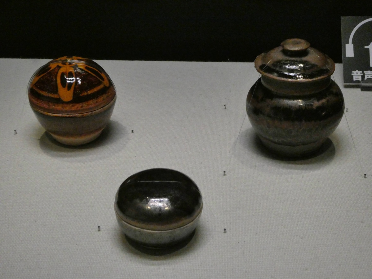 Small lidded jars and boxes with iron black glaze from the Kawai Kanjiro exhibition